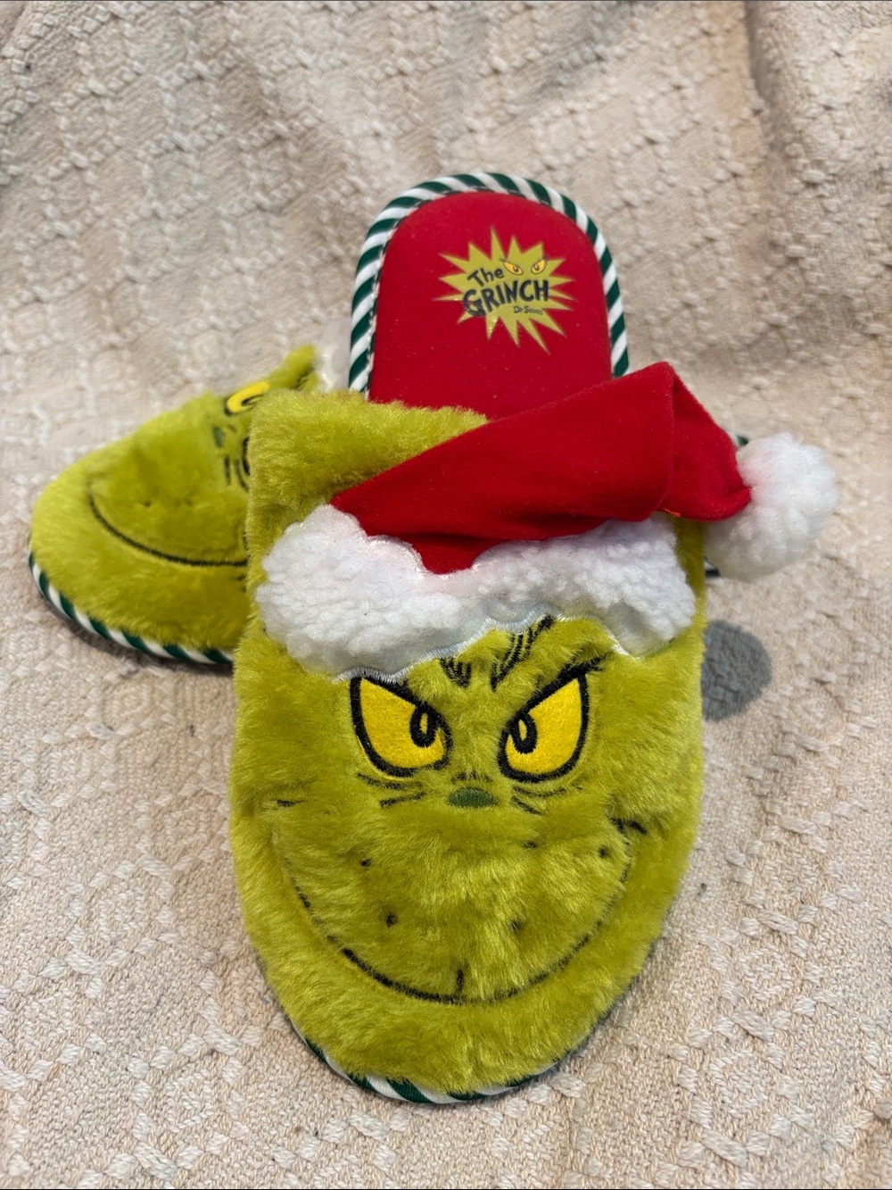 The Grinch Men’s Green Plush Holiday Slippers with Santa Hat
